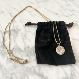 Michael Kors gold toned necklace with rhinestone pendant